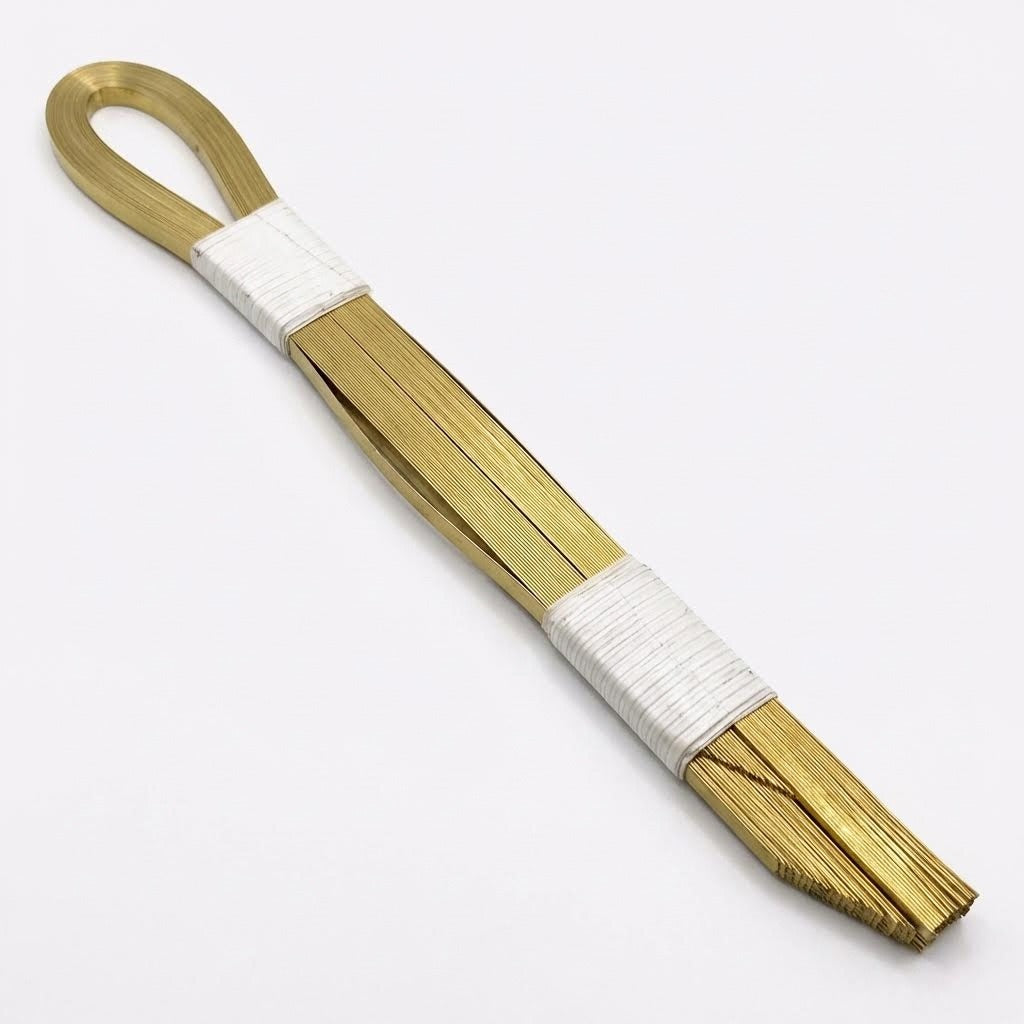 bronze bands cinchos for tortilla machines next to tortilla machine component