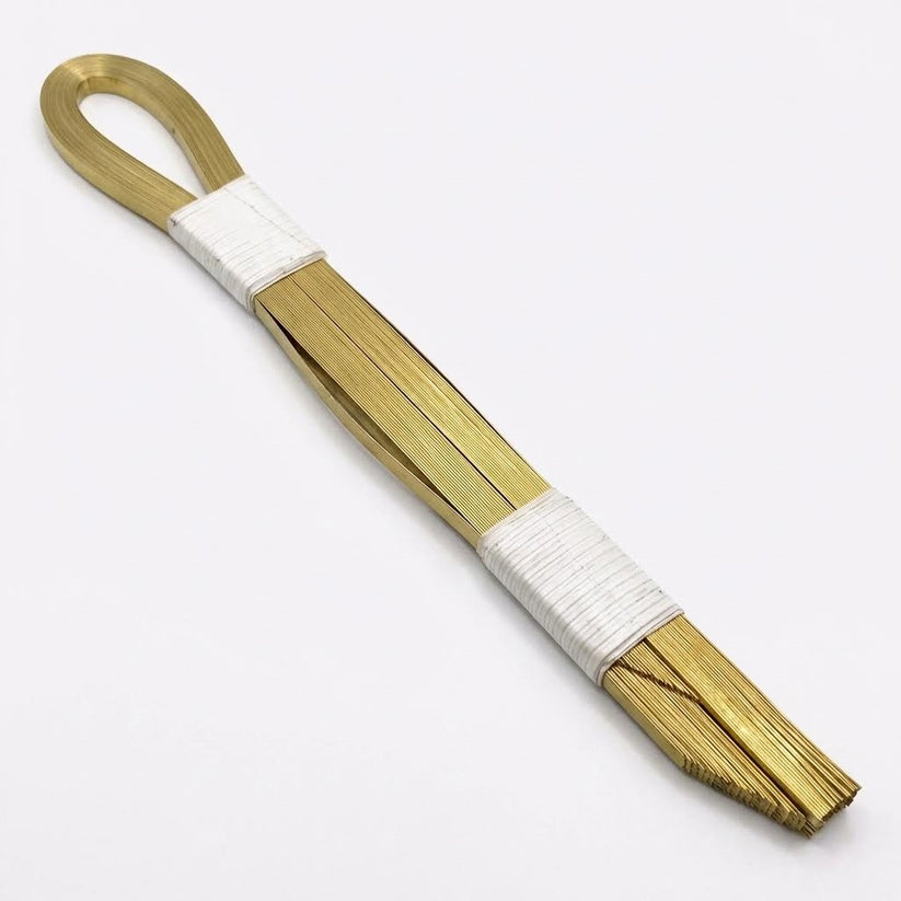bronze bands cinchos for tortilla machines next to tortilla machine component